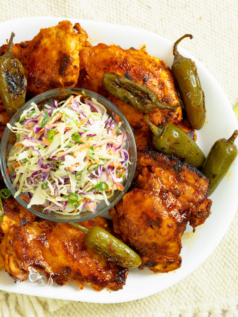 Jalapeño chicken displayed along with coleslaw 